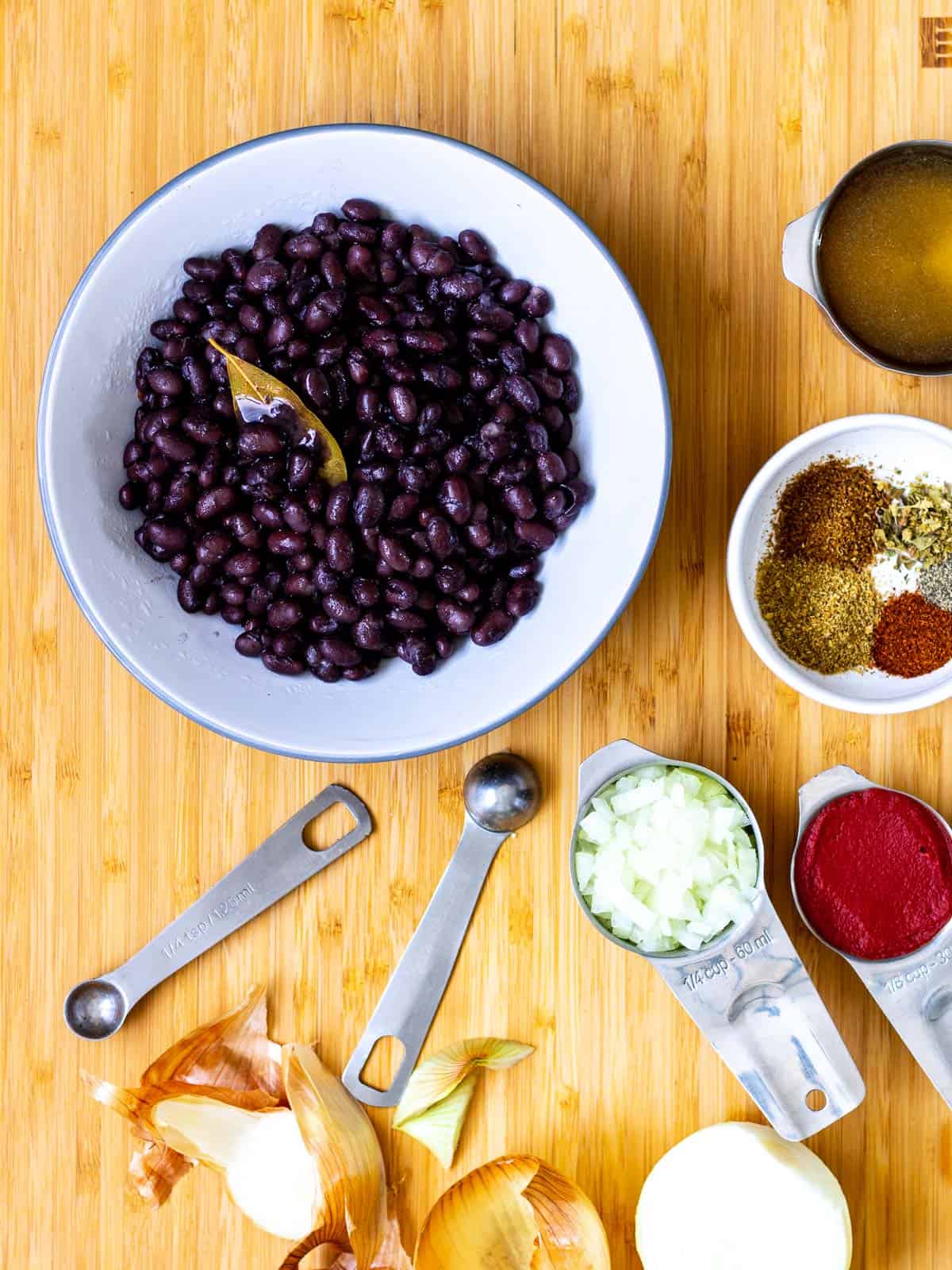 Cooked black beans ready to pan-fry with seasonings.