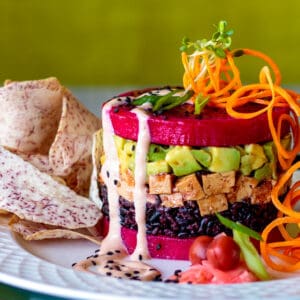 Tofu poke stack with red dragonfruit and avocado.