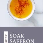 Pinterest graphic with saffron threads soaking in a bowl of orange water.