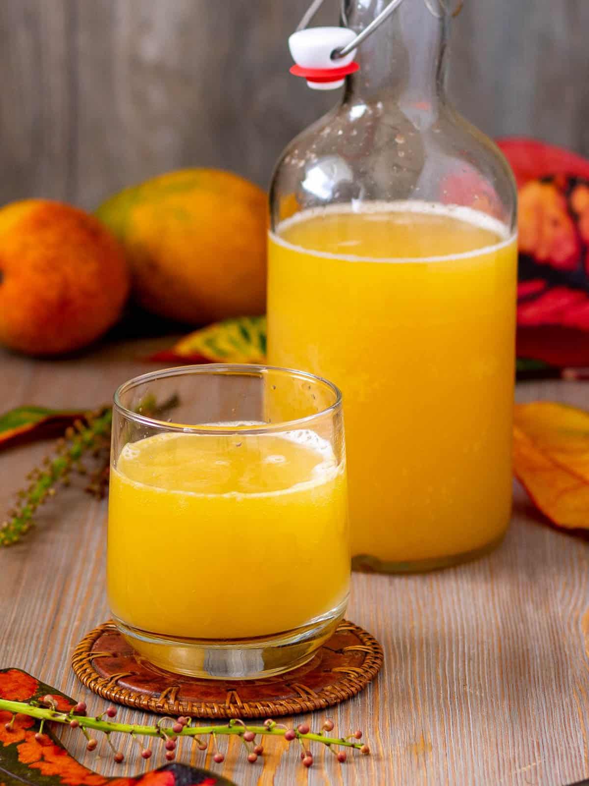 Homemade mango flavored kombucha with natural fermentation and probiotics.