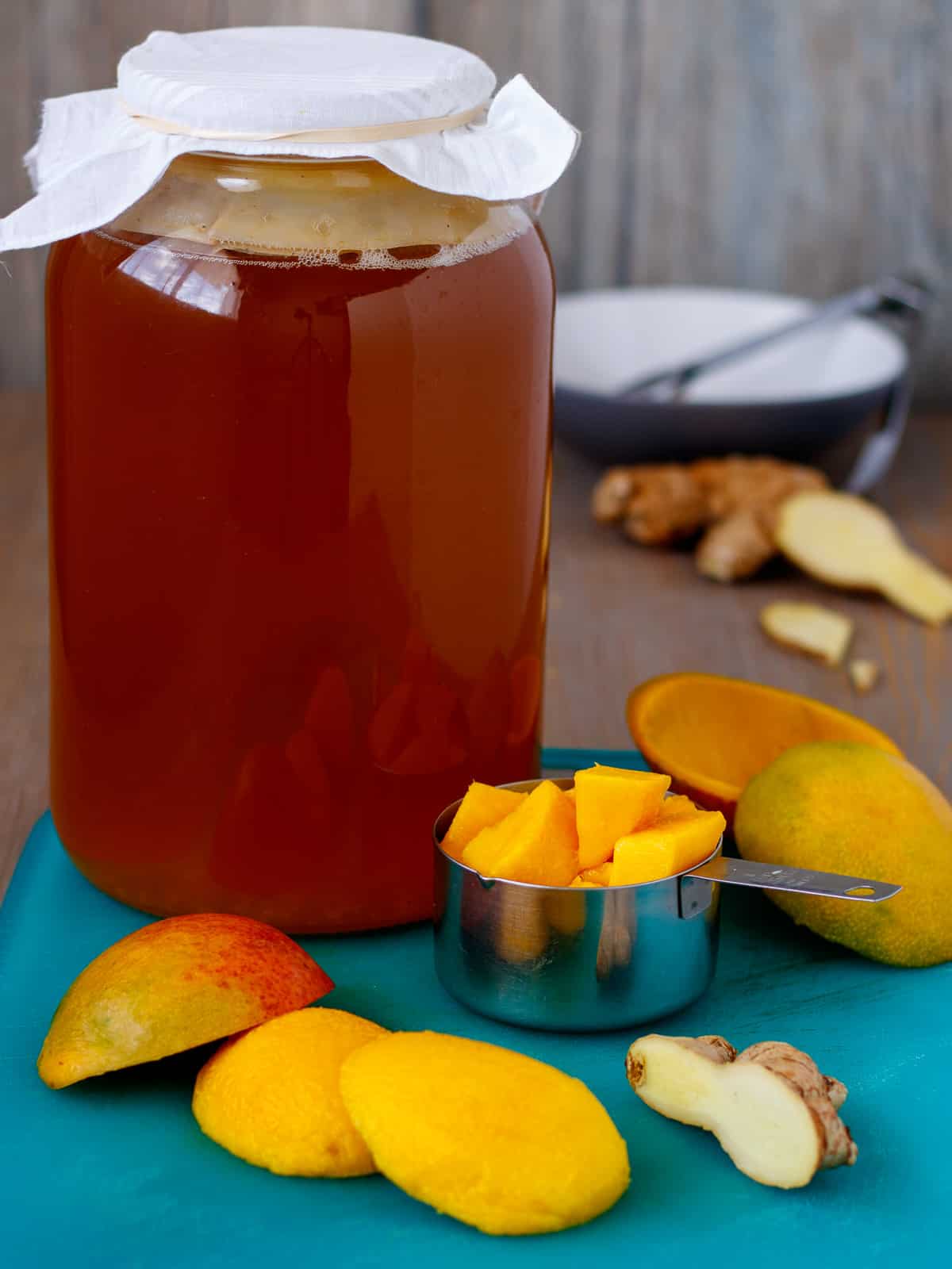 Raw kombucha is combined with fresh mango to create sweetness and natural fermentation.