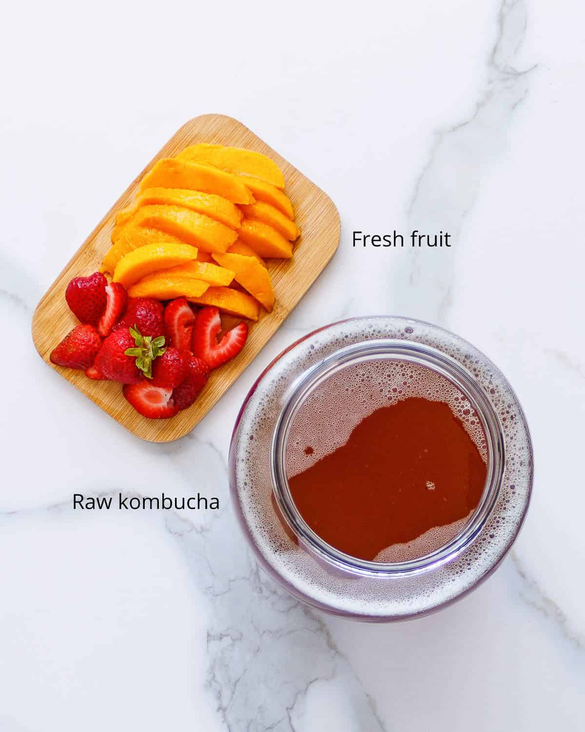 Mango, strawberries and a gallon of kombucha.