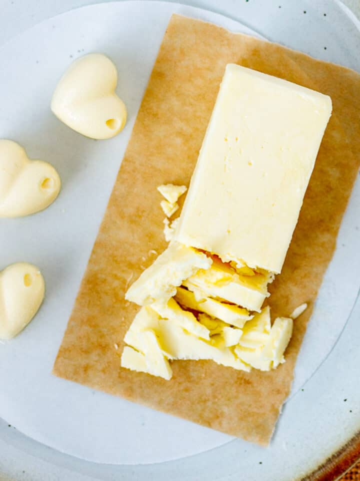 Stick of homemade vegan butter with hearts.