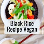 Bowl of black rice topped with colorful veggies.