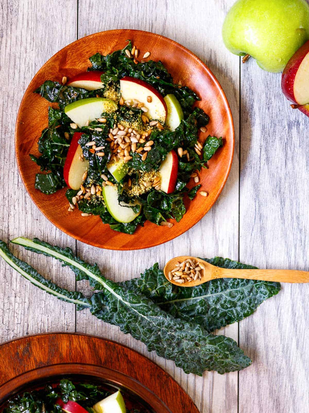 Massaged kale salad with red and green apple and toasted sunflower seeds.