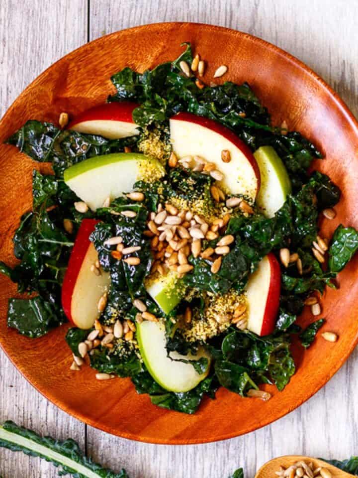 Massaged kale salad with red and green apple and sunflower seeds.