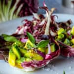 Cucumber and avocado in radicchio leaves with shredded radicchio and flake salt.