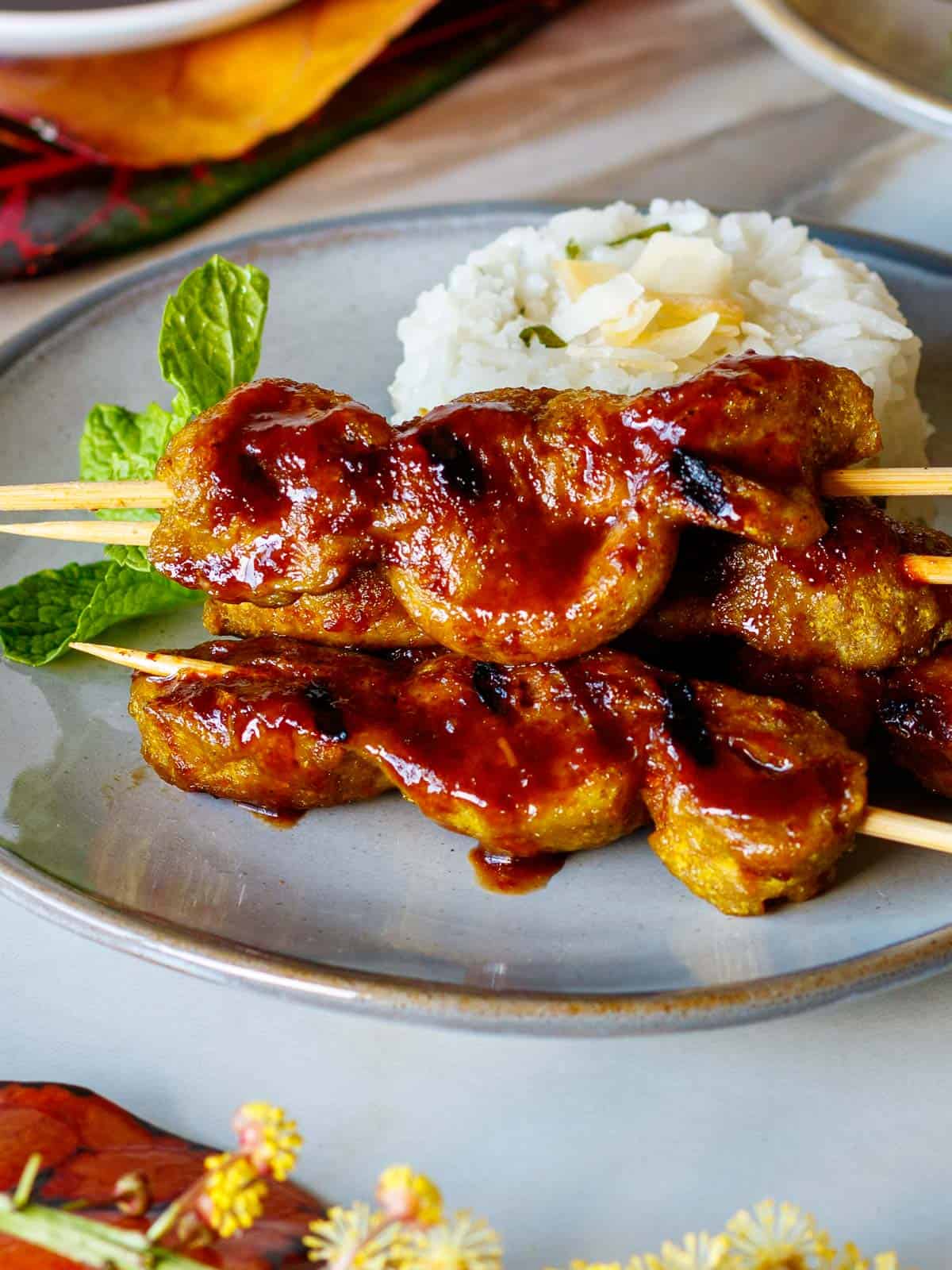 Juicy, chewy seitan skewers dripping with Hawaiian barbecue sauce.