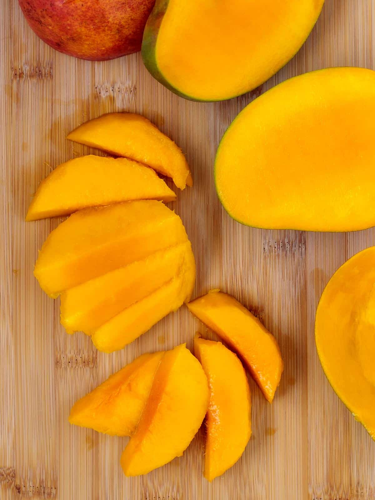 Thick slices of fresh raw mango.