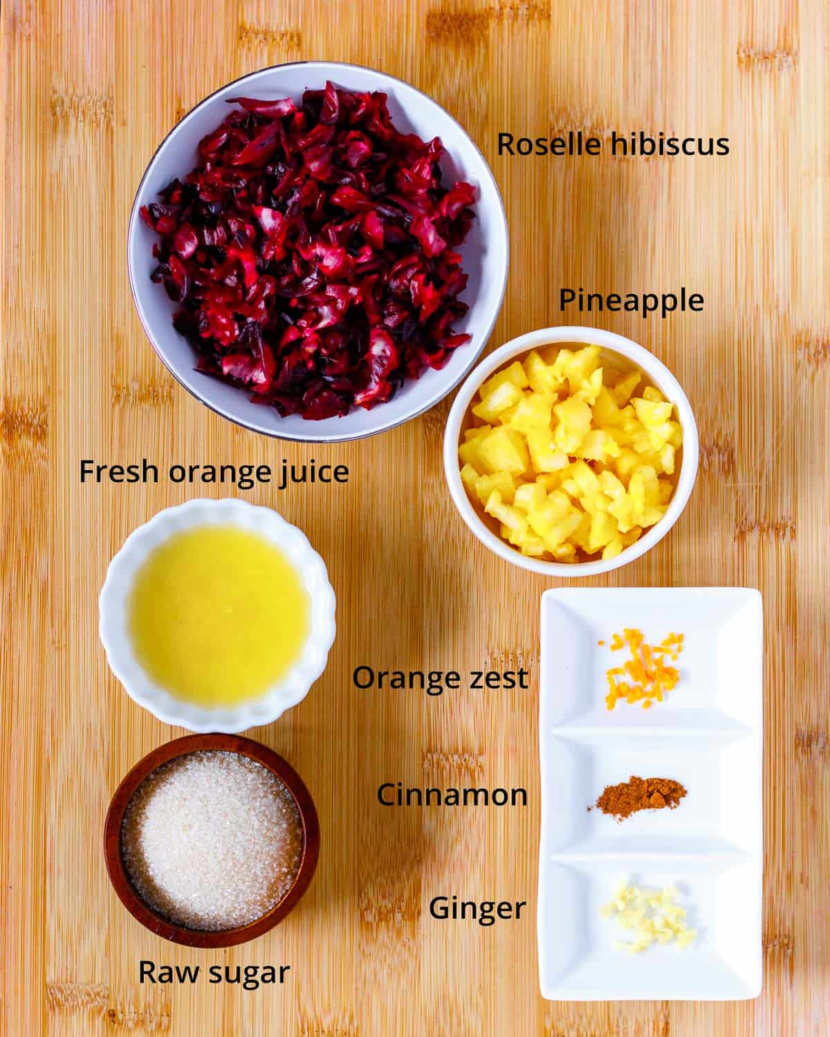 Ingredients to make cranberry sauce with roselle, pineapple and fresh orange.