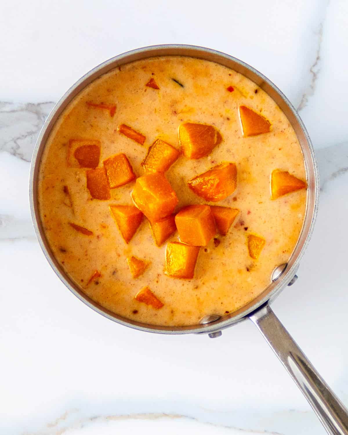 Pan with coconut pumpkin red curry.