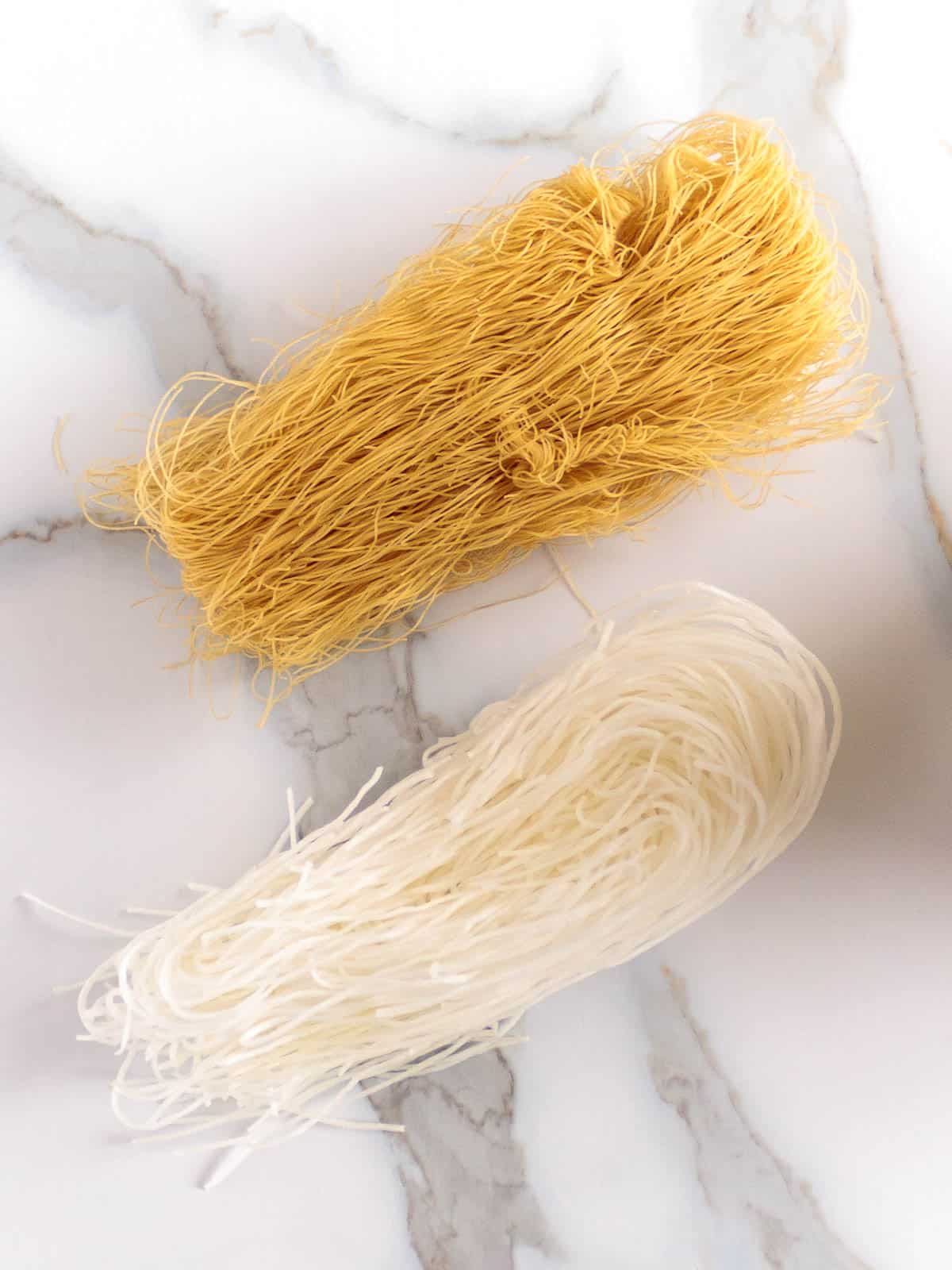 Thin brown rice noodles compared to white mung bean starch noodles.