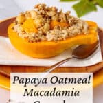 Papaya stuffed with oatmeal and topped with crunchy nuts and seeds.