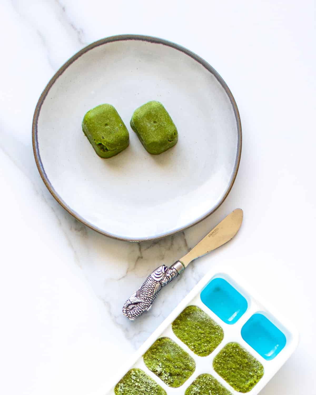 Frozen cubes of green curry paste.