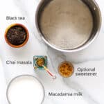 Ingredients to make Indian spiced tea with plant-based milk.